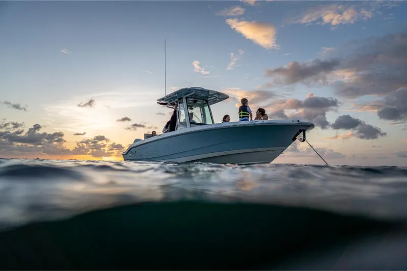 Slide: The Image of 2023 Boston Whaler 280 Dauntless boat on water at sunset. - 10