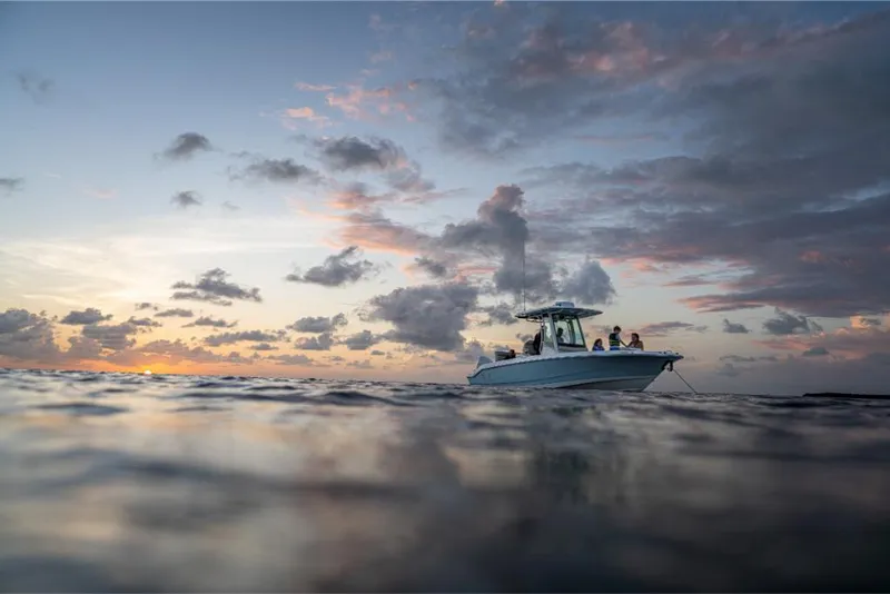Slide: The Image of 2023 Boston Whaler 280 Dauntless boat on water at sunset. - 15