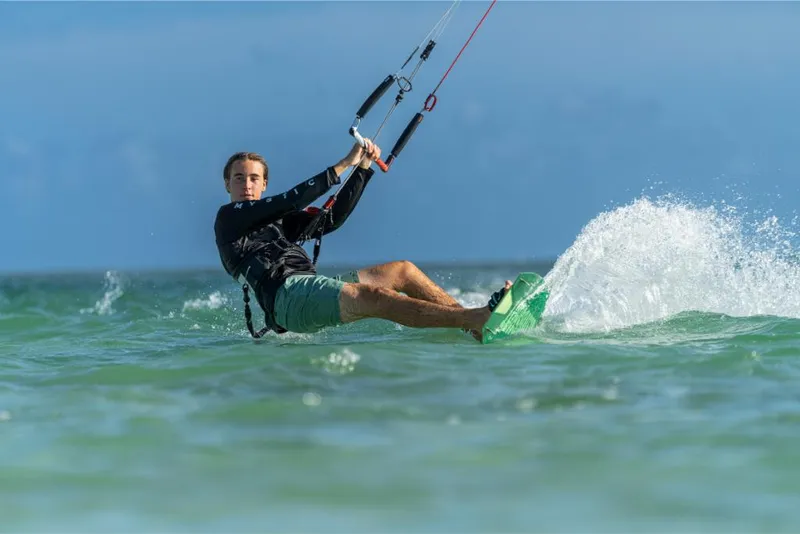 Slide: The Image of Person kiteboarding on the ocean near a 2023 Boston Whaler 280 Dauntless. - 20