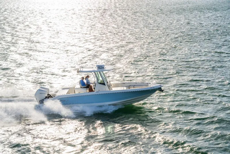 Slide: The Image of 2023 Boston Whaler 280 Dauntless cruising on open water. - 43