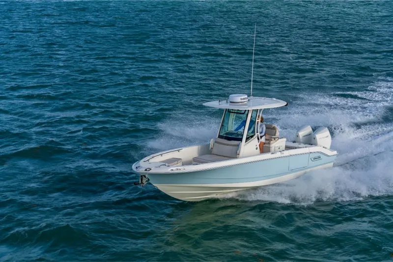 Slide: The Image of 2023 Boston Whaler 280 Dauntless boat cruising on open water. - 46