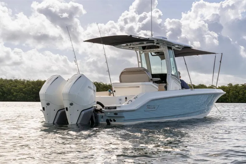 Slide: The Image of 2023 Boston Whaler 280 Dauntless boat on water with twin engines. - 5