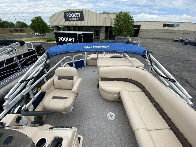Slide: The Image of 2017 Sun Tracker Fishin' Barge 24 DLX pontoon boat with beige seating at Poquet service center. - 8