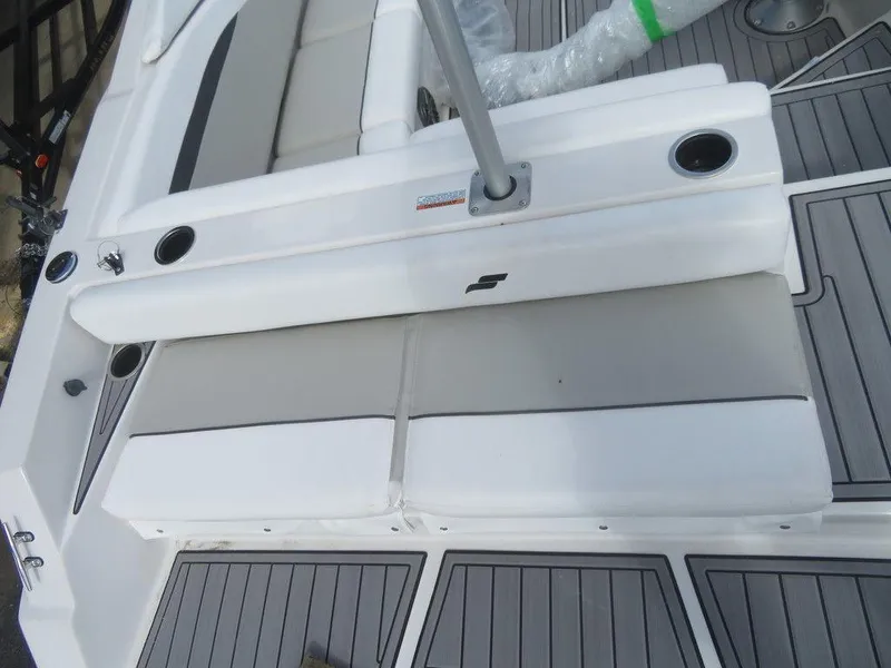 Slide: The Image of 2023 Starcraft SVX OB 231 OB boat interior with white seating and gray flooring. - 13