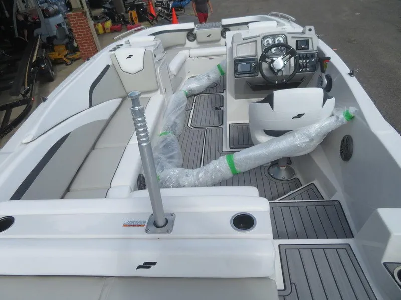 Slide: The Image of 2023 Starcraft SVX OB 231 OB boat interior with modern dashboard and seating. - 16