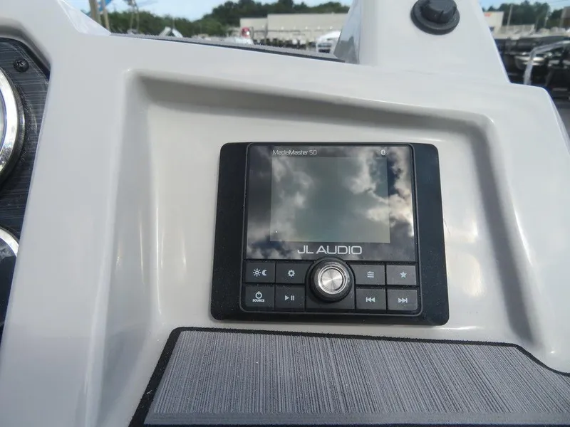 Slide: The Image of 2023 Starcraft SVX OB 231 OB boat dashboard with JL Audio system. - 17