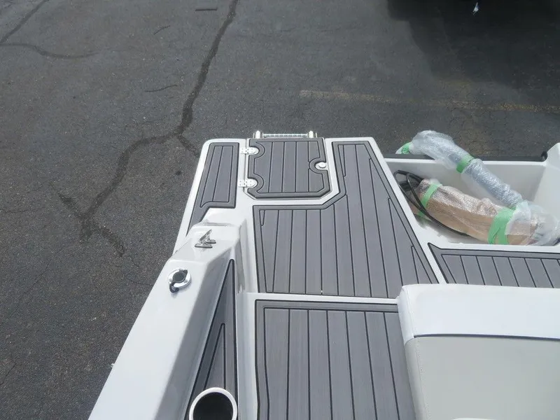 Slide: The Image of 2023 Starcraft SVX OB 231 OB boat deck with gray flooring. - 18