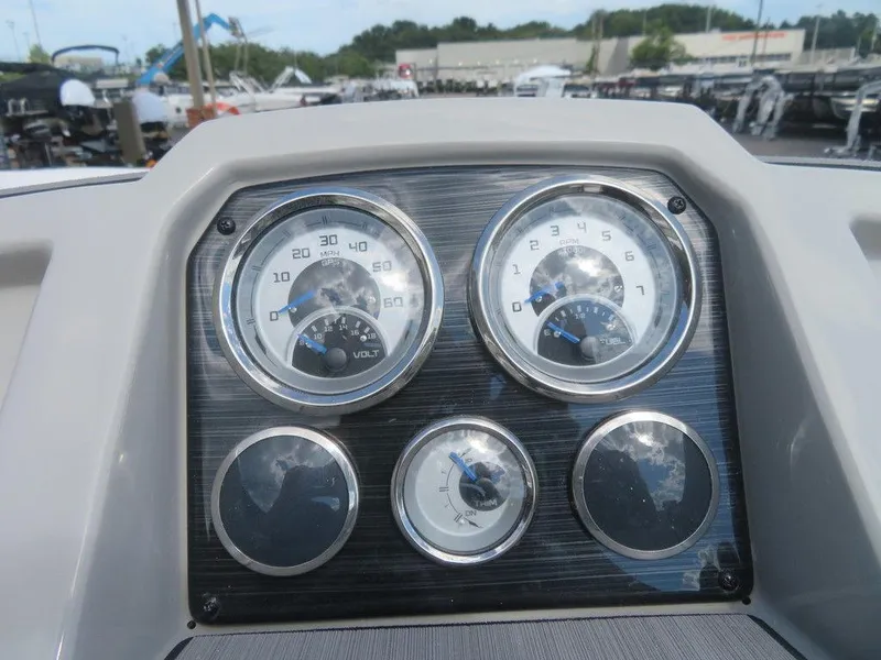 Slide: The Image of Dashboard of 2023 Starcraft SVX OB 231 OB boat with gauges and controls. - 8