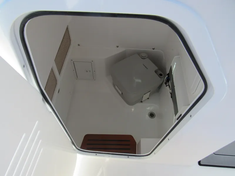 Slide: The Image of Interior view of the 2023 Everglades 253 CC boat's compact restroom. - 10