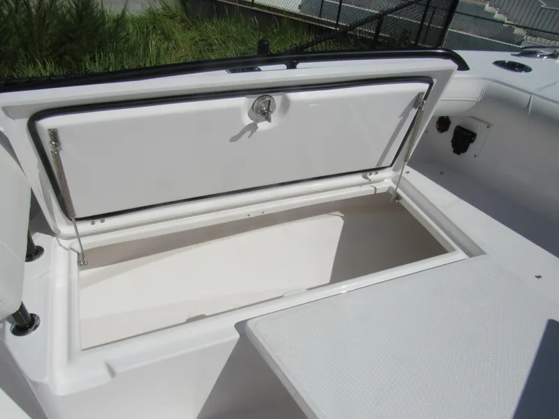 Slide: The Image of Open storage compartment on 2023 Everglades 253 CC boat. - 14
