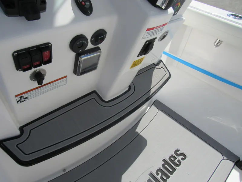 Slide: The Image of Control panel and footrest of 2023 Everglades 253 CC boat. - 18