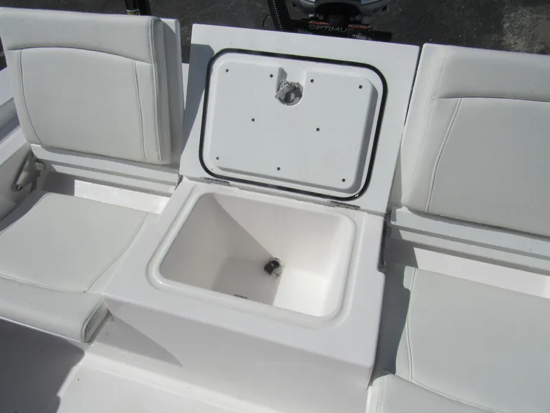 Slide: The Image of 2023 Everglades 253 CC boat seating with storage compartment. - 21