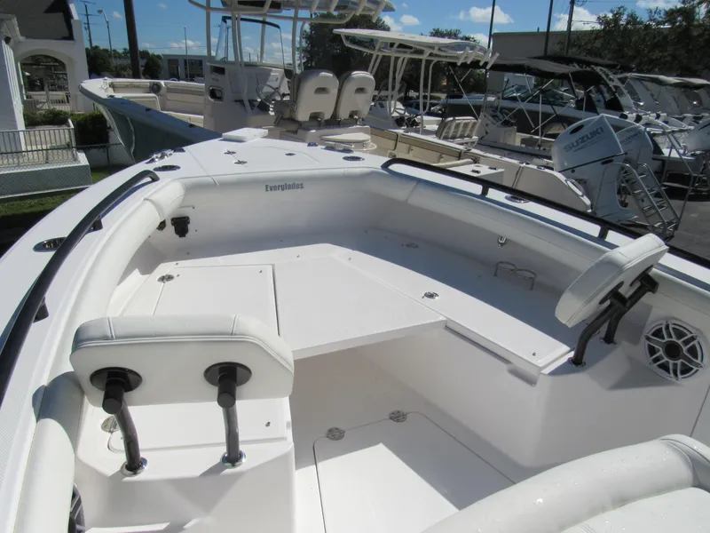 Slide: The Image of 2023 Everglades 253 CC boat interior with seating and storage compartments. - 33