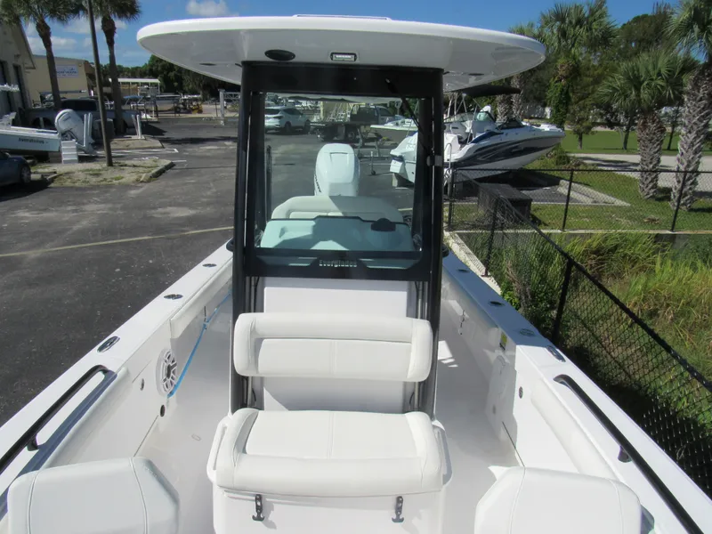 Slide: The Image of 2023 Everglades 253 CC center console boat with white seating and modern design. - 35