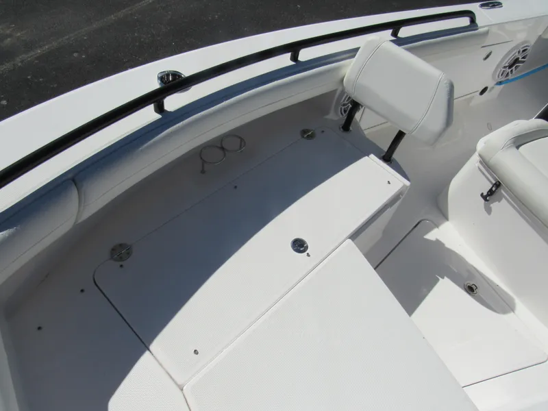 Slide: The Image of 2023 Everglades 253 CC boat interior seating and storage compartments. - 36