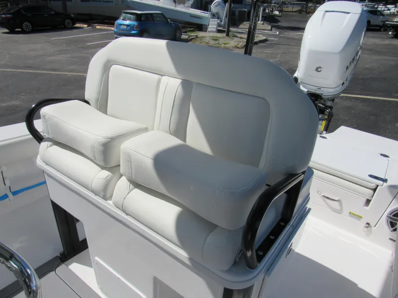 Slide: The Image of 2023 Everglades 253 CC boat with white cushioned seating and black handrails - 37