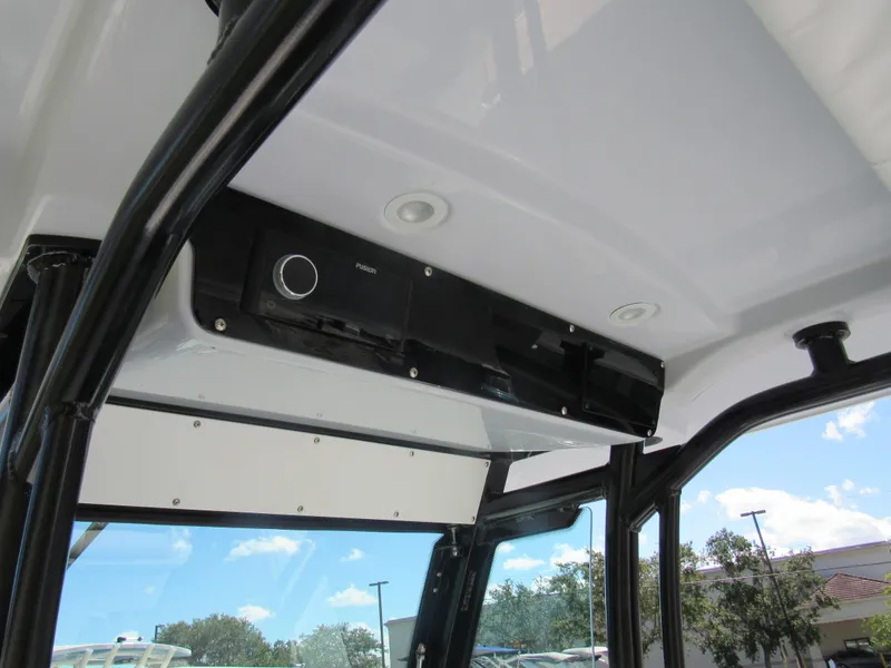 Slide: The Image of Interior view of 2023 Everglades 253 CC boat with Fusion stereo system. - 7