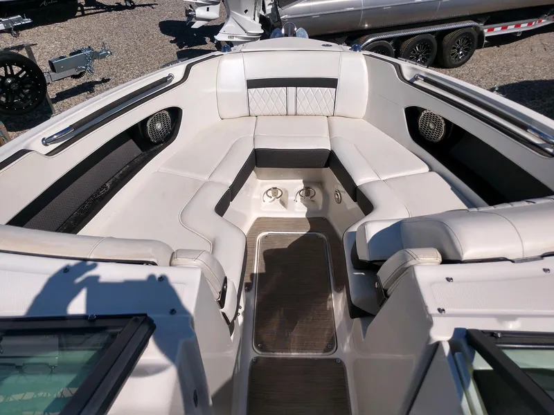 Slide: The Image of 2018 Sea Ray SLX 280 boat interior with white leather seating and stainless steel accents. - 15