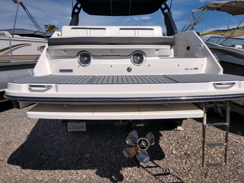 Slide: The Image of 2018 Sea Ray SLX 280 boat rear view with swim platform and ladder. - 6