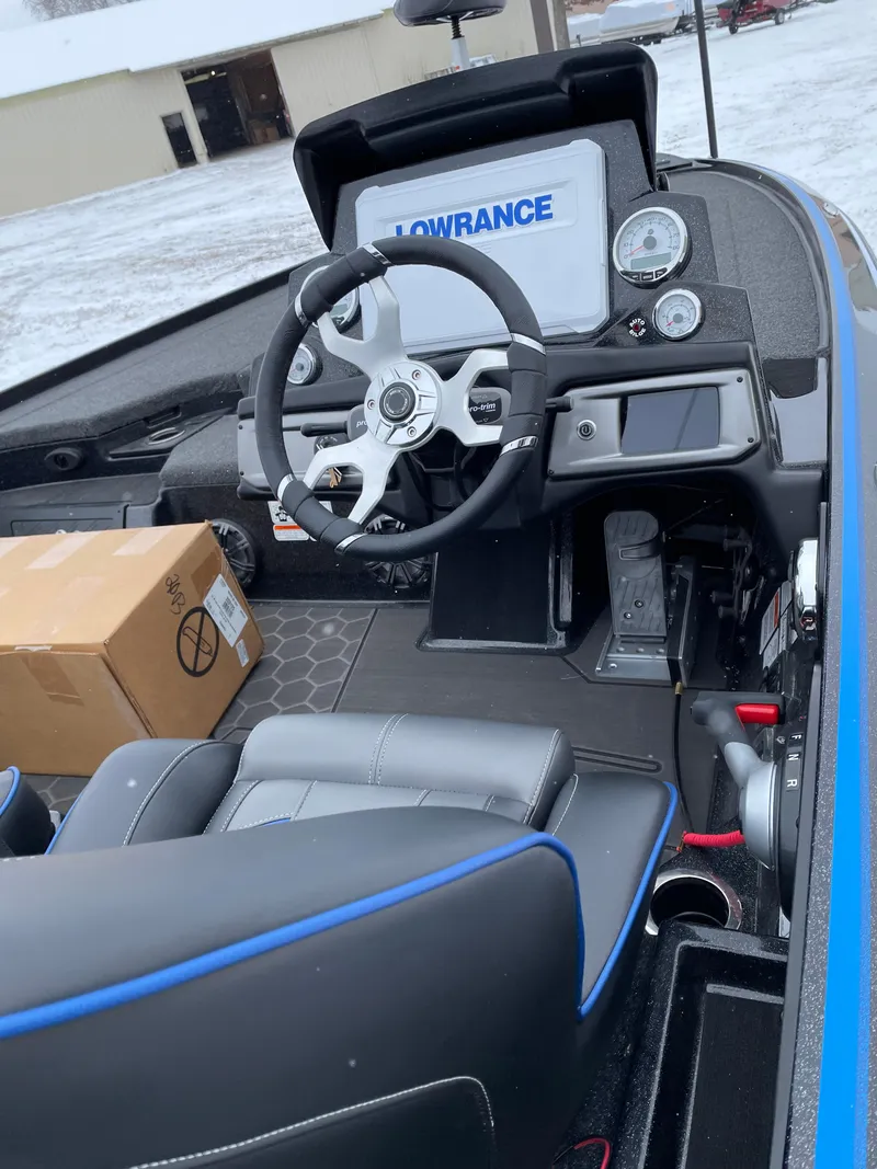 Slide: The Image of 2023 Nitro Z20 boat cockpit with Lowrance electronics and steering wheel. - 1