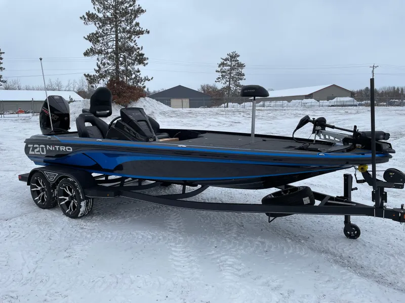 Slide: The Image of 2023 Nitro Z20 fishing boat on a snowy landscape. - 2