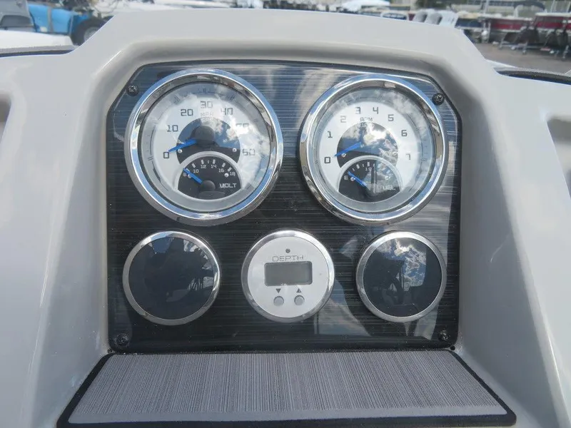 Slide: The Image of 2023 Starcraft SVX OB 191 OB dashboard with gauges and digital display. - 14