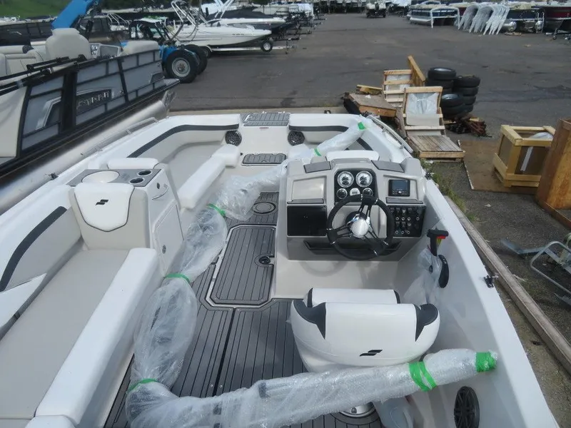 Slide: The Image of 2023 Starcraft SVX OB 191 OB boat interior at a marina. - 17