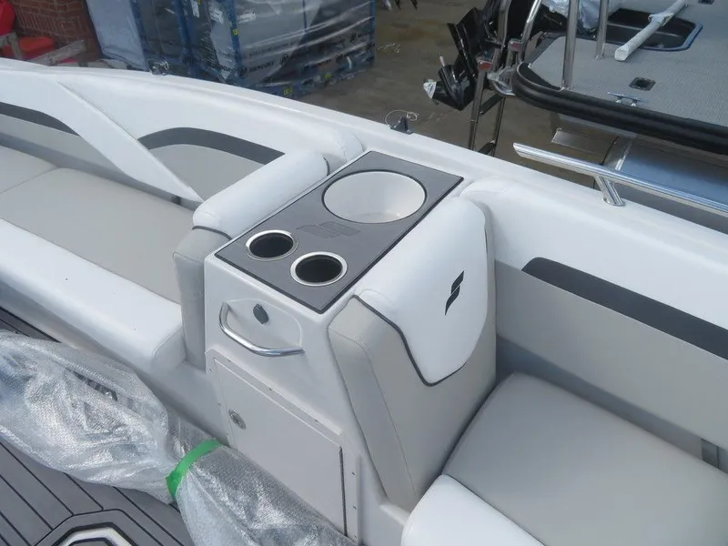 Slide: The Image of 2023 Starcraft SVX OB 191 OB boat interior with cup holders and storage. - 5