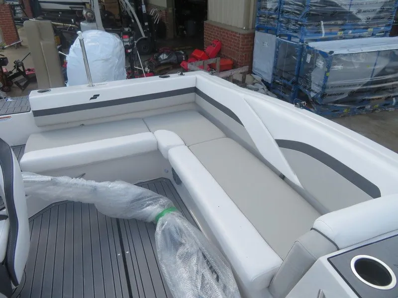 Slide: The Image of 2023 Starcraft SVX OB 191 OB boat interior with gray and white seating. - 7