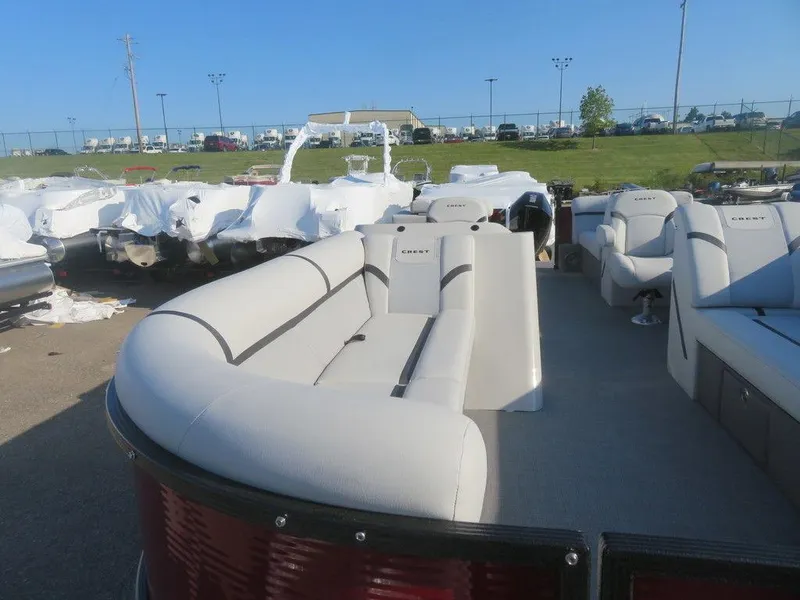 Slide: The Image of 2023 Crest Classic LX 240 SLC CPT pontoon boat with spacious seating. - 12