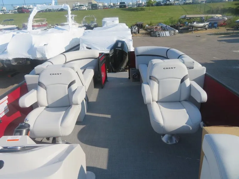 Slide: The Image of 2023 Crest Classic LX 240 SLC CPT pontoon boat with luxurious seating. - 14