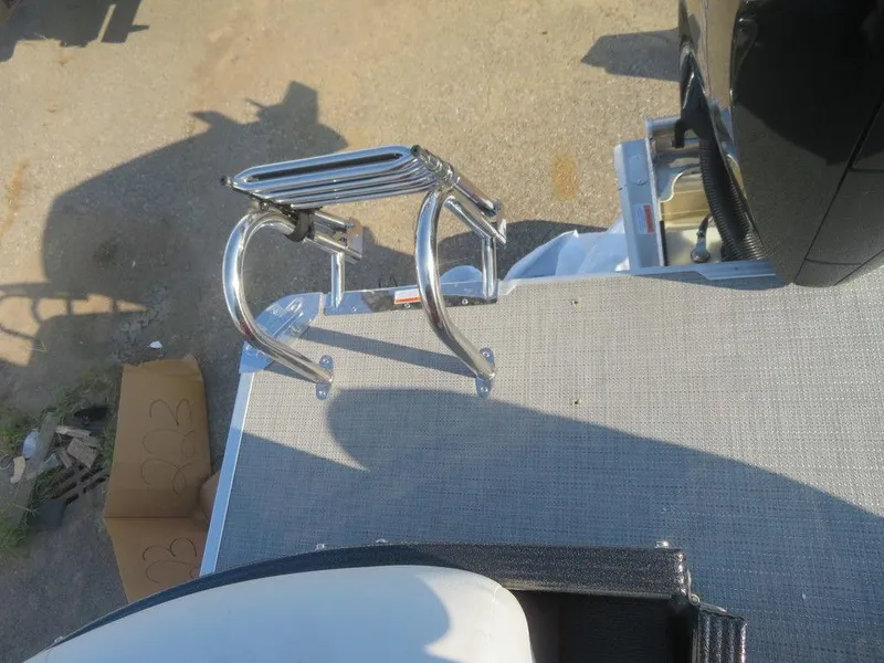 Slide: The Image of 2023 Crest Classic LX 240 SLC CPT boat with a stainless steel swim ladder. - 2