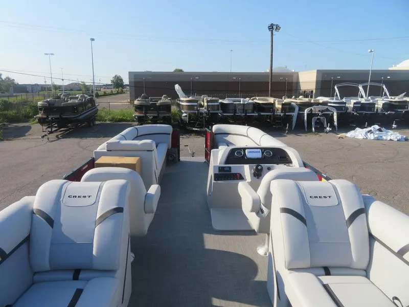 Slide: The Image of 2023 Crest Classic LX 240 SLC CPT pontoon boat interior with plush seating. - 3