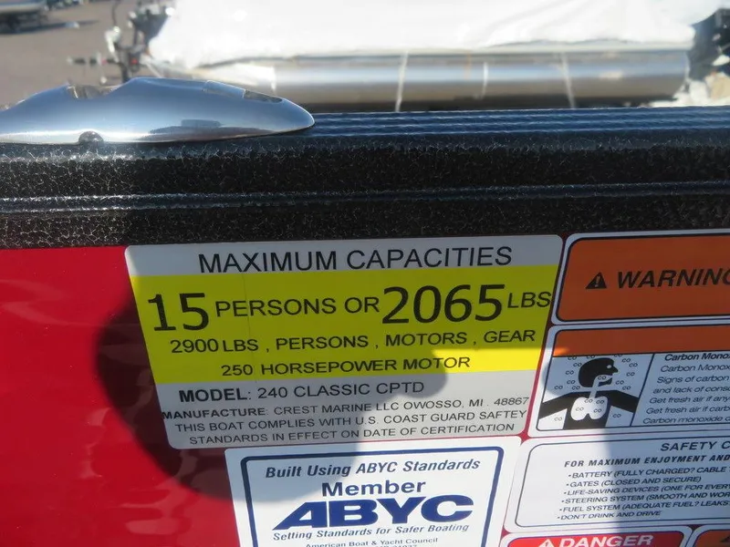 Slide: The Image of 2023 Crest Classic LX 240 SLC CPT boat capacity label, 15 persons or 2065 lbs, 250 HP motor. - 6