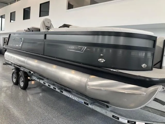 Slide: The Image of 2023 Viaggio Diamante 23U pontoon boat on a trailer in a showroom. - 10