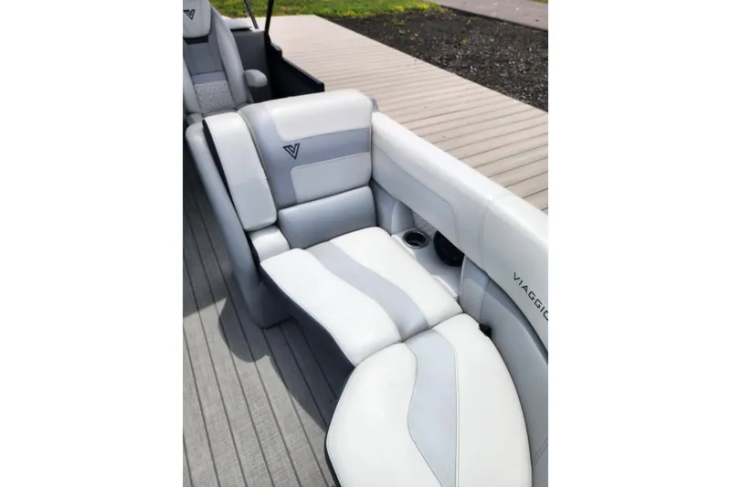 Slide: The Image of Luxurious seating in 2023 Viaggio Diamante 23U boat, featuring sleek gray upholstery. - 21