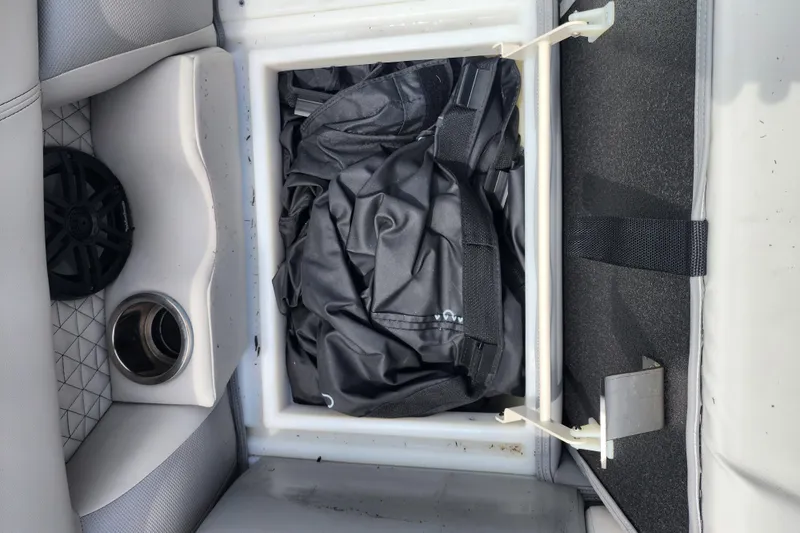 Slide: The Image of Storage compartment in 2023 Viaggio Diamante 23U boat with speaker and cup holder. - 26