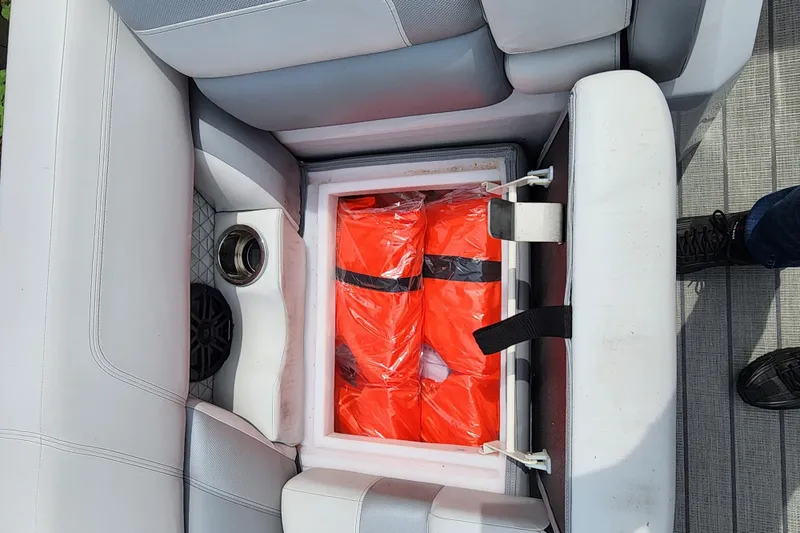 Slide: The Image of Storage compartment with life jackets in a 2023 Viaggio Diamante 23U boat. - 28