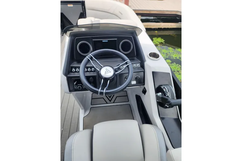 Slide: The Image of 2023 Viaggio Diamante 23U boat dashboard with steering wheel and controls. - 32