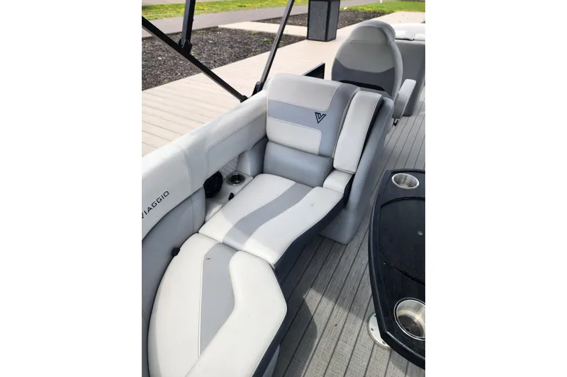 Slide: The Image of 2023 Viaggio Diamante 23U boat interior with gray seating and cup holders. - 35