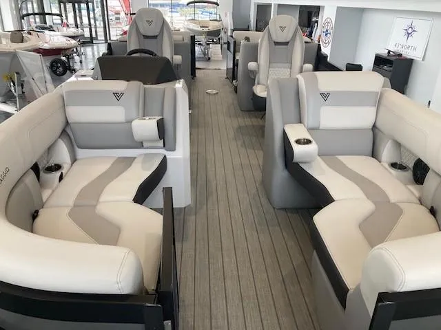 Slide: The Image of 2023 Viaggio Diamante 23U pontoon boat docked on a serene lake. - 4