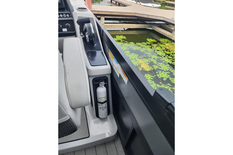 Slide: The Image of Interior of 2023 Viaggio Diamante 23U boat with control panel and fire extinguisher. - 43