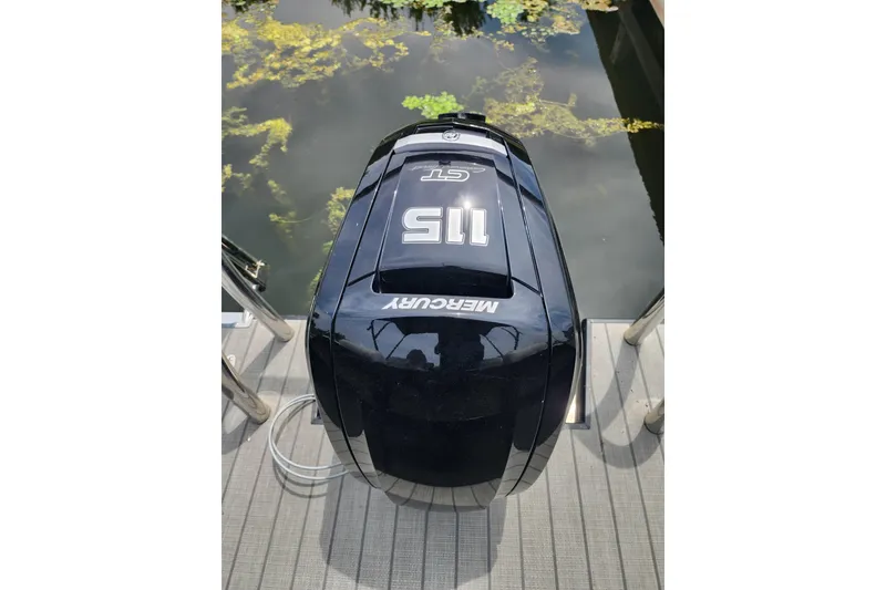 Slide: The Image of Outboard motor on Viaggio Diamante 23U boat, 2023 model, docked by water. - 45
