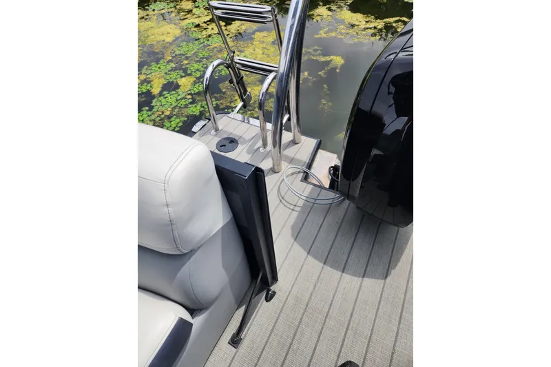 Slide: The Image of 2023 Viaggio Diamante 23U boat deck with ladder and seating, near water. - 46