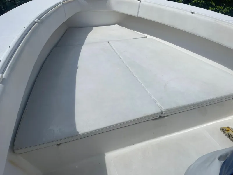 Slide: The Image of 2004 Venture 34 Open boat with spacious white deck seating area. - 6
