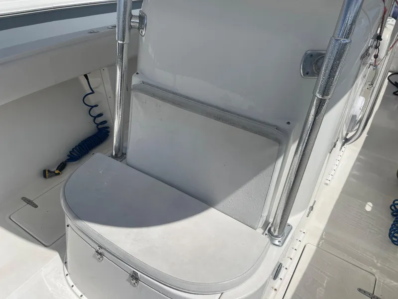 Slide: The Image of 2004 Venture 34 Open boat interior with seating and storage compartment. - 7