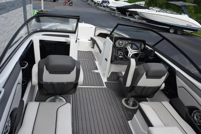 Slide: The Image of 2017 Yamaha Boats 212 Limited interior with seating and steering console. - 6