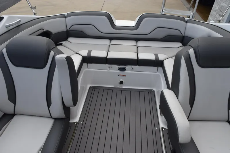 Slide: The Image of 2017 Yamaha Boats 212 Limited interior seating area with gray and black upholstery. - 7