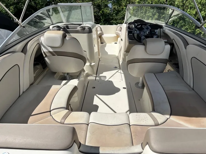 Slide: The Image of 2014 Yamaha Boats 242 Limited interior with beige seating and dual consoles. - 5
