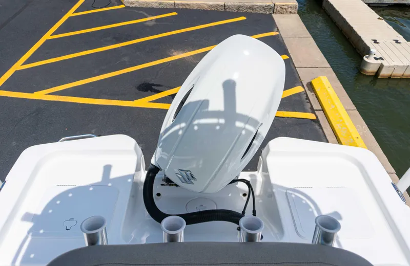 Slide: The Image of 2023 Savannah 190 IS boat engine at dock with yellow parking lines. - 18